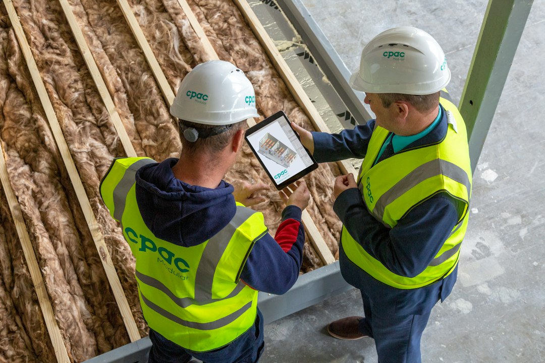 Construction engineers examining site reports